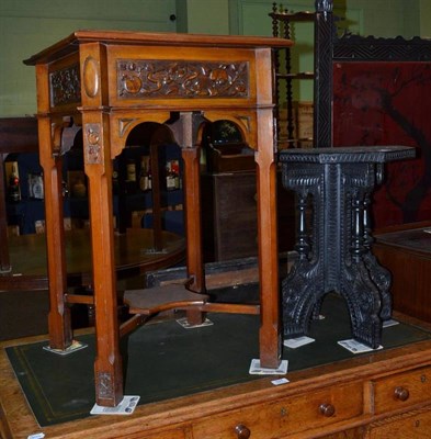 Lot 528 - Arts & Crafts carved occasional table and an Eastern ebonised table