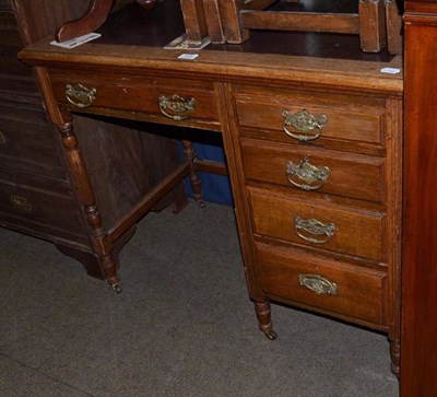 Lot 538 - Edwardian oak kneehole desk