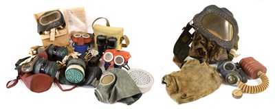 Lot 190 - A Second World War "Mickey Mouse" Gas Mask for...