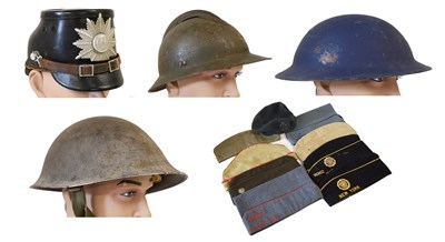 Lot 256 - Thirteen Pieces of Military Headgear,...