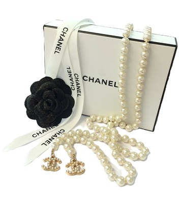 Lot 1071 - Chanel, A Faux Pearl Lariat Necklace with Two...