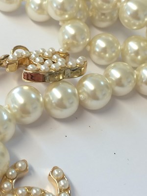 Lot 1071 - Chanel, A Faux Pearl Lariat Necklace with Two...