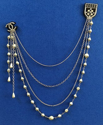 Lot 1073 - Chanel, A Faux Pearl Chain With Double Pin...