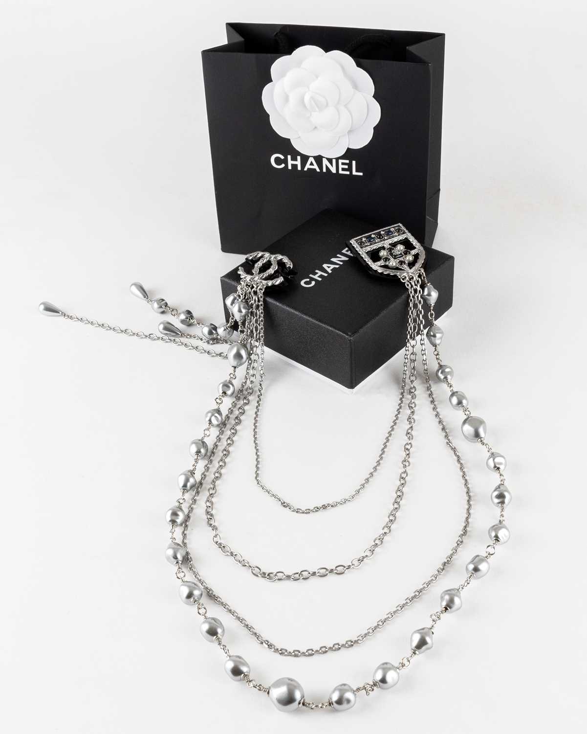 Lot 1073 - Chanel, A Faux Pearl Chain With Double Pin...