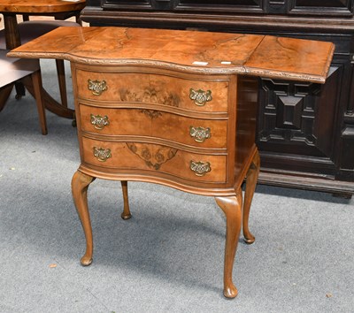 Lot 526 - A Figured Walnut Double Bow Fronted Drop-Leaf...