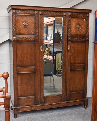 Lot 538 - An Oak Mirror Fronted Triple Wardrobe, first...