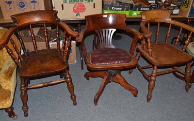 Lot 641 - Early 20th century ash swivel office chair and two captain's chairs (3)