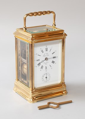 Lot 150 - A Brass Strike and Repeat Alarm Carriage Clock,...