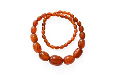 Lot 319 - An Amber Bead Necklace, length 60cm...