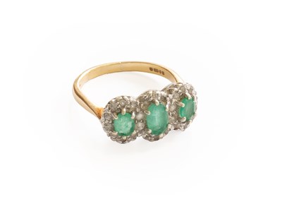 Lot 395 - A 9 Carat Gold Emerald and Diamond Triple...