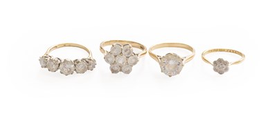 Lot 439 - A Diamond Cluster Ring, stamped '18CT', finger...