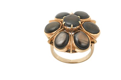 Lot 2247 - A Star Sapphire Cluster Ring the raised round...
