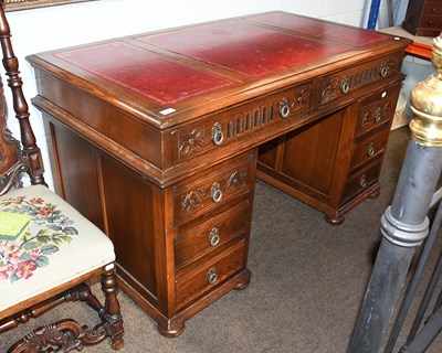 Lot 576 - A 20th Century Red Leather Inset Oak Pedestal...