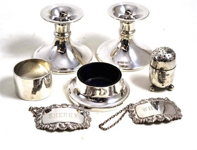 Lot 26 - Pair of dwarf candlesticks, two silver decanter labels, napkin ring, salt and a pepperette