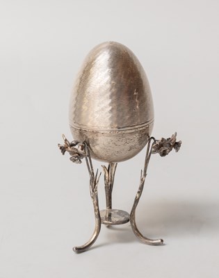 Lot 29 - An Elizabeth II Silver Novelty Egg and Stand,...