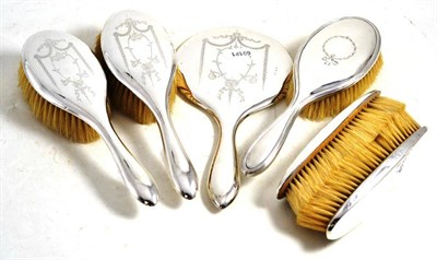 Lot 45 - Five silver backed brushes and a mirror (6)
