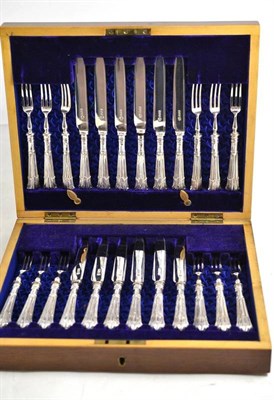 Lot 55 - A set of twelve silver bladed handled pastry knives and forks in a fitted mahogany case