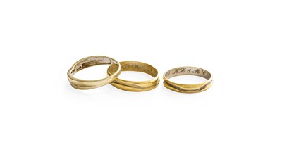 Lot 354 - A Bi-Colour 18 Carat Gold Band Ring, finger...