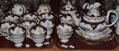 Lot 70 - A Victorian English porcelain gilt and blue border tea service with floral decoration and...