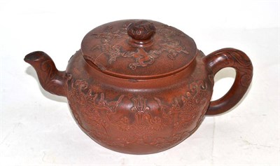 Lot 85 - A large Chinese Yixing pottery teapot, decorated with scrolling motifs