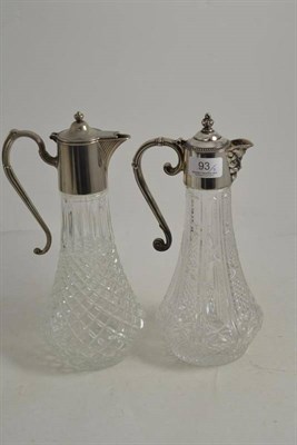 Lot 93 - Two moulded and metal mounted claret jugs