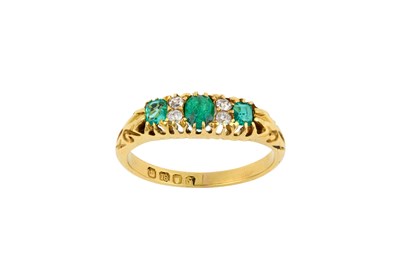 Lot 2412 - An 18 Carat Gold Emerald and Diamond Ring...