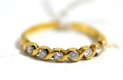 Lot 122 - An 18ct gold seven stone diamond ring