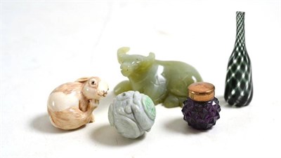 Lot 130 - A Japanese ivory netsuke, jade type carved bead, jade type water buffalo, a miniature green and...