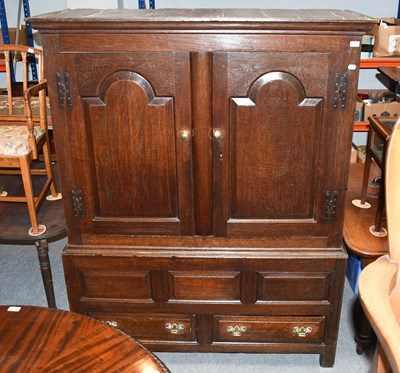 Lot 1285 - An 18th Century Oak Livery Cupboard, with...