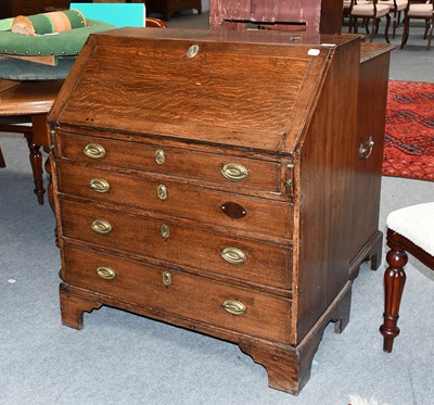 Lot 1260 - A George III Oak Bureau, with four long...