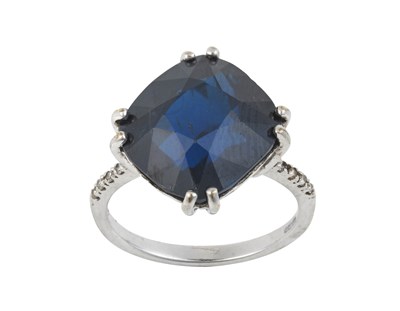 Lot 2306 - A 9 Carat White Gold Sapphire Ring the cushion...