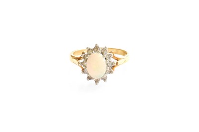 Lot 371 - An Opal and Diamond Cluster Ring, the oval...