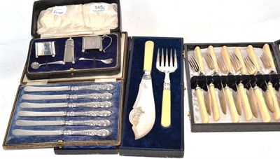 Lot 145 - A cased silver condiment set, cased plated fisher servers and eaters, cased silver handled tea...