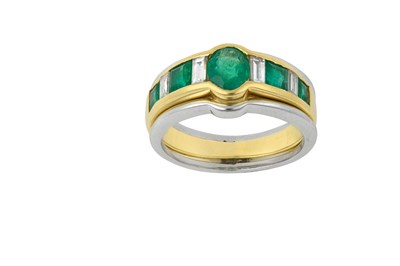 Lot 2259 - An Emerald and Diamond Ring the oval cut...