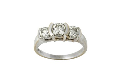 Lot 2299 - A Diamond Three Stone Ring the graduated round...