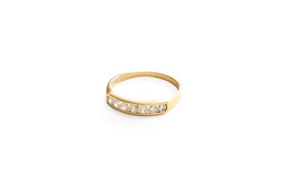Lot 457 - A Diamond Half Hoop Ring, seven round...
