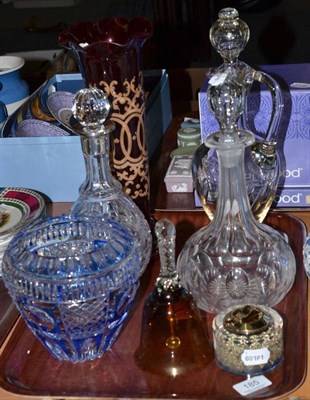 Lot 185 - A blue overlay vase, a ruby vase, three decanters, a bell and a lighter