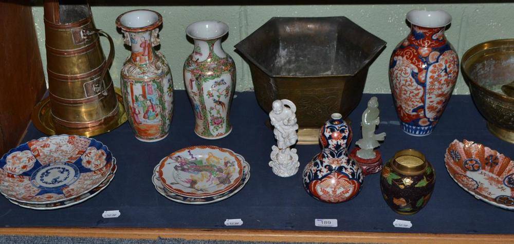 Lot 189 - A shelf of Oriental brass and copper, Cantonese vases, Imari etc