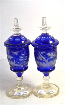 Lot 196 - Pair of etched blue glass urns and covers