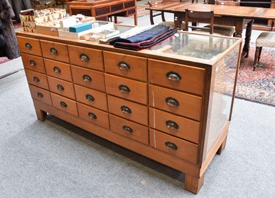 Lot 1345 - A Glazed Oak Haberdashery Shop Display Counter,...