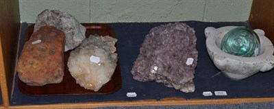 Lot 203 - Various mineral rocks, a mortar and a glass ball float weight (on one shelf)