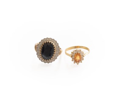 Lot 454 - A 9 Carat Gold Sapphire and Diamond Cluster...
