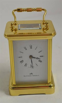Lot 207 - A brass carriage timepiece, signed Matthew Norman