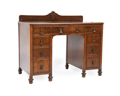 Lot 560 - A 1920's/30's Walnut Kneehole Desk by Shapland...