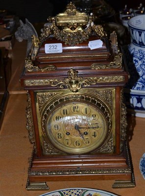 Lot 232 - An Edwardian mahogany cased half striking mantel clock, the case fitted with brass mounts and a...