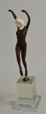 Lot 235 - Art Deco style bronze nude, on a stepped glass base