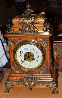 Lot 238 - Late Victorian oak and brass striking bracket clock