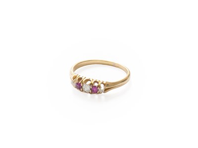 Lot 225 - A Ruby and Diamond Five Stone Ring, two round...