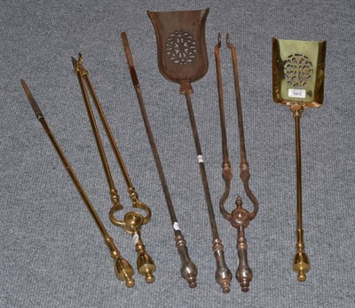 Lot 246 - A set of steel fire irons and a set of brass fire irons (6)
