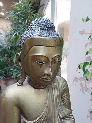 Lot 82 - A Malaysian Bronze Figure of a Seated Buddha,...